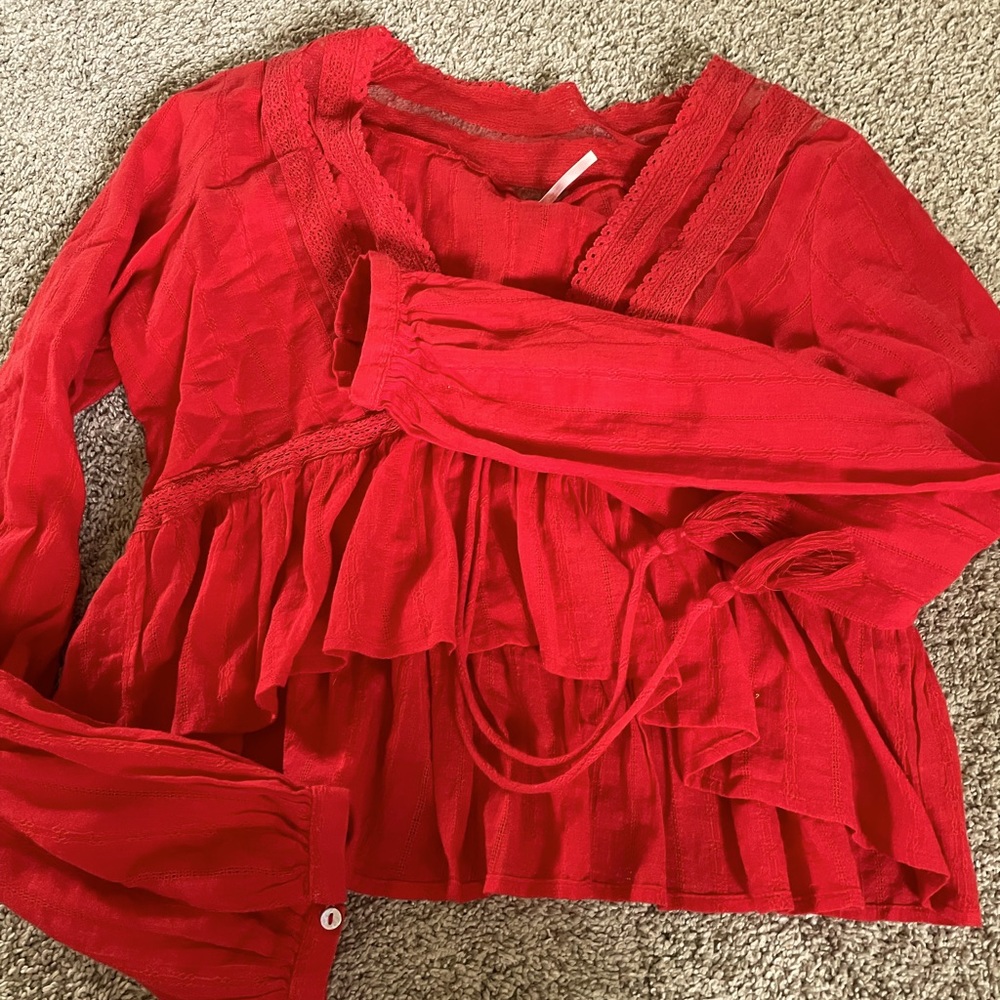 This is a really pretty Free People top- worn maybe one time!